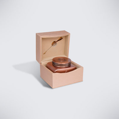 Open pink gift box holding the rose copper Dukhoun Hamdan jar with spoon, bakhoor gift